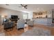 Open living room and kitchen layout with hardwood floors and a cozy seating area at 5363 S Emerald Desert Dr, Gold Canyon, AZ 85118