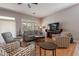 Living room with comfortable seating and large TV at 5363 S Emerald Desert Dr, Gold Canyon, AZ 85118