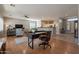 Open concept living room with kitchen, hardwood floors and a view of the entryway at 5363 S Emerald Desert Dr, Gold Canyon, AZ 85118