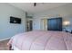 Main bedroom with TV and access to the bathroom at 5363 S Emerald Desert Dr, Gold Canyon, AZ 85118
