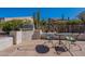 Outdoor patio area with grill and seating for two at 5363 S Emerald Desert Dr, Gold Canyon, AZ 85118
