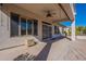 Covered patio with sliding glass door and storage bin at 5363 S Emerald Desert Dr, Gold Canyon, AZ 85118