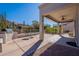 Covered patio with seating area and built-in grill at 5363 S Emerald Desert Dr, Gold Canyon, AZ 85118