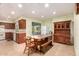 Eat-in kitchen with wood cabinets, tiled floor, and a hutch at 551 S Esquire Way, Mesa, AZ 85202