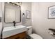 Small bathroom with a modern vanity and a white toilet at 5715 N 105Th Ln, Glendale, AZ 85307