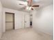 Bright bedroom with double closet and ceiling fan at 5715 N 105Th Ln, Glendale, AZ 85307