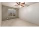 Simple bedroom with neutral walls and ceiling fan at 5715 N 105Th Ln, Glendale, AZ 85307