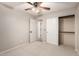 Bedroom with ceiling fan and double door closet at 5715 N 105Th Ln, Glendale, AZ 85307