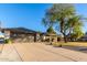 Single story home with a two-car garage and mature tree at 5715 N 105Th Ln, Glendale, AZ 85307