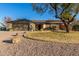 Single-story home with a two-car garage and landscaped yard at 5715 N 105Th Ln, Glendale, AZ 85307