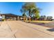 House exterior showcasing a large front yard and driveway at 5715 N 105Th Ln, Glendale, AZ 85307