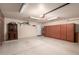 Two-car garage with storage cabinets and wall decor at 5715 N 105Th Ln, Glendale, AZ 85307