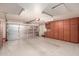 Two-car garage with built-in storage cabinets at 5715 N 105Th Ln, Glendale, AZ 85307