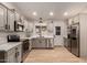 Modern kitchen with stainless steel appliances and light cabinets at 5715 N 105Th Ln, Glendale, AZ 85307