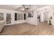 Open living area with hardwood floors and a view to kitchen at 5715 N 105Th Ln, Glendale, AZ 85307