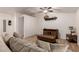 Spacious living room featuring a cozy sofa and wood coffee table at 5715 N 105Th Ln, Glendale, AZ 85307