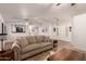 Open living room with large windows and hardwood floors at 5715 N 105Th Ln, Glendale, AZ 85307