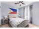 Well-lit bedroom with ceiling fan and plush bed at 6492 W Sonoma Way, Florence, AZ 85132