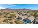 Aerial view of house and community, mountain backdrop at 6512 E Hacienda La Noria Ln, Gold Canyon, AZ 85118