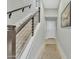 Modern staircase with metal railing and light wood steps at 6565 E Thomas Rd # 1091, Scottsdale, AZ 85251