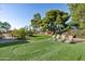 Artificial putting green and lounge chairs in backyard at 7032 E Dreyfus Ave, Scottsdale, AZ 85254