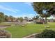 Large backyard with pool, putting green, and plenty of grass space at 7032 E Dreyfus Ave, Scottsdale, AZ 85254