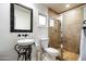 Bathroom with pedestal sink, toilet, and shower at 7032 E Dreyfus Ave, Scottsdale, AZ 85254