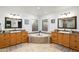 Elegant bathroom with corner bathtub, double sinks, and granite countertops at 7032 E Dreyfus Ave, Scottsdale, AZ 85254