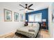 Bedroom with blue accent wall and ceiling fan at 7032 E Dreyfus Ave, Scottsdale, AZ 85254
