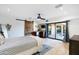 Bedroom with barn door and private access to the backyard at 7032 E Dreyfus Ave, Scottsdale, AZ 85254