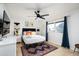 Bedroom with white dresser and ceiling fan at 7032 E Dreyfus Ave, Scottsdale, AZ 85254