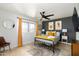 Bedroom with yellow accents and ceiling fan at 7032 E Dreyfus Ave, Scottsdale, AZ 85254