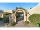 Elegant entryway with arched walkway and a blue front door at 7032 E Dreyfus Ave, Scottsdale, AZ 85254