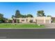 Single-story home with a three-car garage and landscaped front yard at 7032 E Dreyfus Ave, Scottsdale, AZ 85254