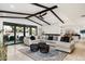 Luminous living room featuring a sectional sofa and access to the backyard at 7032 E Dreyfus Ave, Scottsdale, AZ 85254