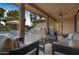 Covered patio with comfortable seating and outdoor kitchen at 7032 E Dreyfus Ave, Scottsdale, AZ 85254