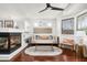 Cozy sitting area with a fireplace and built in shelving at 7032 E Dreyfus Ave, Scottsdale, AZ 85254