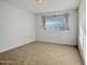 Bright bedroom with neutral carpeting and window coverings at 9209 N 102Nd Dr, Sun City, AZ 85351