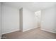 Simple carpeted bedroom with neutral walls at 948 E Anderson Ave, Phoenix, AZ 85022