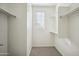 Bright walk-in closet with window and ample shelving at 948 E Anderson Ave, Phoenix, AZ 85022