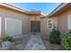 Front entry with double doors and tile walkway at 10814 W Thunderbird Blvd, Sun City, AZ 85351