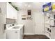 Laundry room with washer, dryer, and extra shelving at 10814 W Thunderbird Blvd, Sun City, AZ 85351