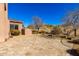 Landscaped backyard with a paved patio and desert landscaping at 10855 E Elba Way, Scottsdale, AZ 85262