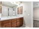 Double vanity bathroom with marble countertop at 10855 E Elba Way, Scottsdale, AZ 85262