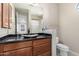 Bathroom with granite vanity, vessel sink, and toilet at 10855 E Elba Way, Scottsdale, AZ 85262