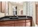 Bathroom boasts a modern vanity with granite countertop at 10855 E Elba Way, Scottsdale, AZ 85262