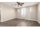 Bright bedroom with wood-look floors and ceiling fan at 10855 E Elba Way, Scottsdale, AZ 85262