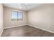 Well-lit bedroom featuring wood-look floors and a window at 10855 E Elba Way, Scottsdale, AZ 85262