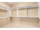 Large walk-in closet with ample shelving and hanging space at 10855 E Elba Way, Scottsdale, AZ 85262