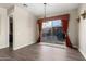 Elegant dining room with hardwood floors and sliding glass doors to patio at 10855 E Elba Way, Scottsdale, AZ 85262